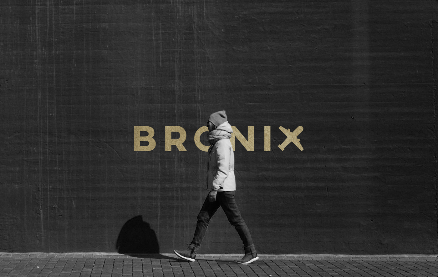 Bronix — Illuminated Urban Signage on Brick Wall